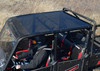 SuperATV tinted roof on a red Polaris Ranger XP 900 Crew with riders, viewed from above the cab