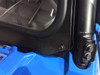 Close-up of the Extreme Metal Products glass windshield lower corner clamp bolted to the cage of the blue Polaris General