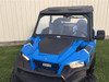 Extreme Metal Products laminated glass windshield with wiper installed on a blue Polaris General, front three-quarter view