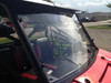 Extreme Metal Products full windshield installed on a red Polaris Ranger, side three-quarter view of the cab