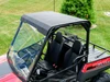 Spike roof and windshield combo for Polaris Ranger 150 Youth: roof and windshield on a red Polaris Ranger, high rear view