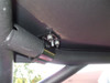 Close-up under the Extreme Metal Products steel top showing the bolted clamp bracket on the Ranger cage tube