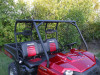 Red full size Polaris Ranger with the Extreme Metal Products steel top installed, front three-quarter view