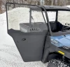 SCM door kit for Polaris Ranger SP 570 2-door: full door on a blue UTV, side close-up in snow