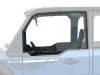 SCM door kit for Polaris Xpedition XP and ADV: upper front door on a faded blue UTV, side close-up