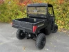 Spike rear windshield for Polaris Ranger 500: rear windshield on a black Polaris Ranger, rear corner view