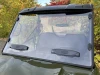 Spike windshield for Polaris Ranger 500: windshield with two vents on a green UTV, front view outdoors