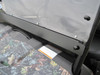 Close-up of the Extreme Metal Products windshield lower edge and hood clamp on the camo Polaris Ranger mid size