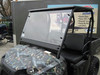Extreme Metal Products tinted windshield installed on a camo Polaris Ranger mid size in a shop, front three-quarter view