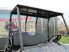 Front three-quarter view of the black steel roof with dome light on the Polaris Ranger mid size cage