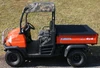 Greene Mountain Kubota roof cover in camo on an orange Kubota, side view