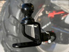 ATV-Tek Trio HD hitch installed in the rear receiver of a machine with a knobby tire behind it, close-up