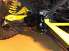 Extreme Metal Products high clearance rear hitch bolted under a Can-Am Maverick with yellow suspension arms