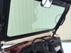 View from inside the cab through the Extreme Metal Products glass windshield on a Kawasaki Mule 4010