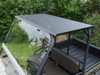 Extreme Metal Products flat black steel top on a camo Kawasaki Mule with windshield, viewed from above the front