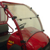 Kolpin full tilt windshield installed on a red Kawasaki Mule 610, side view with the windshield closed