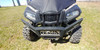 Front close-up of the 3 Star vinyl windshield and cab on a black side-by-side with a tube front bumper