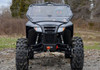 Straight-on front view of the black Arctic Cat Wildcat Trail with the SuperATV full windshield closed, winch visible