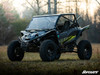 Full front three-quarter view of the gray Yamaha YXZ with the SuperATV front bumper in a grassy field with trees