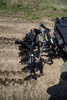 Kolpin DirtWorks disc plow hitch arms and frame attached to the back of an ATV, close view