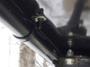 Close-up of the Extreme Metal Products hard top clamp bracket bolted to the John Deere Gator XUV cage tube