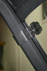Spike windshield for Can-Am Defender and Defender MAX: close-up of a mounting knob and clamp on the cage tube