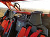 Spike Powersports rear window with sliding vent seen from the front seats of the Can-Am Maverick X3 at sunset