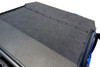 Top-down close-up of the textured black ABS roof surface and mounting bolts