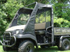 Front three-quarter view of the camo Kawasaki Mule 3010 with the 3 Star enclosure doors behind a hard windshield