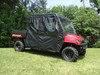 3 Star full cab enclosure on a red Polaris Ranger 700 Crew, black cab with clear windows, side view on grass