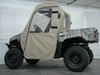 3 Star tan full cab enclosure installed on a camo Yamaha Rhino in a studio, side view with the doors closed