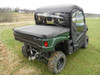 3 Star full cab enclosure with rear window on a green Yamaha Viking, rear three-quarter view with bed cover