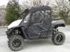 Driver side front view of the Yamaha Wolverine with the 3 Star full cab enclosure doors zipped closed