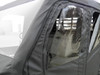 Close-up of a zippered door window on the 3 Star Kawasaki Mule ProFXT cab enclosure showing the seats inside