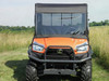 3 Star full cab enclosure with vinyl windshield on an orange Kubota RTV X900, straight front view in a field