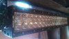 Moto Alliance Sirius LED light bar mounted on a roll cage tube and lit, close-up of the dual-row lenses