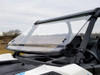 Spike Powersports full tilting windshield tilted open on a white Can Am Maverick Trail, front three-quarter view
