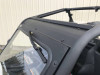 Side close-up of the glass windshield black frame edge and wiper arm on the Can-Am Maverick Trail