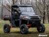 SuperATV 4 inch portal gear lift on a gray side-by-side with cab, roof and mud tires, front three-quarter view
