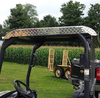 Close-up of the Wiedmann Bros diamond plate aluminum roof on a Kubota RTV, showing the tread texture and edge