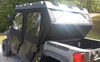 Rear three-quarter view of the Side X Side cab enclosure on an Odes Dominator X4 showing the rear window panel and bed