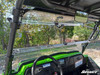 View from inside the Kawasaki Teryx4 cab through the flipped open SuperATV windshield with mirror and wheel
