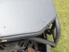 Close-up of the rear edge and mounting bolt of the Extreme Metal Products aluminum top over the Maverick cage bar