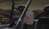 Seizmik side view mirror clamped to a 2-inch roll cage, rendered cab view with desert hills through the windshield