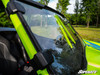 Close-up of the SuperATV full windshield clamps on the green cage pillar of a Textron Wildcat XX, inside view