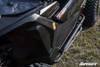Angled view down the Maverick X3 door showing the SuperATV nerf bar and step tube from above
