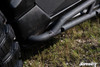 Low close-up of the SuperATV nerf bar front mount and bent tube end at the Maverick X3 rocker