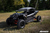 Front three-quarter view of the Maverick X3 from the driver side with SuperATV nerf bars fitted