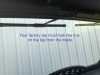 Inside view of the Extreme Metal Products glass windshield top edge and wiper arm meeting the Wolverine X2 factory roof