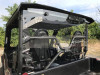 Rear view of the Extreme Metal Products cab back panel on the Yamaha Wolverine X2 showing the seats and cage through it